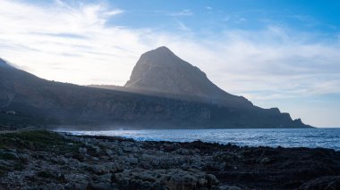 Sunset view of Monte Cofano with beach and sea. San Vito Lo Capo, Macari, Sicily, Italy.