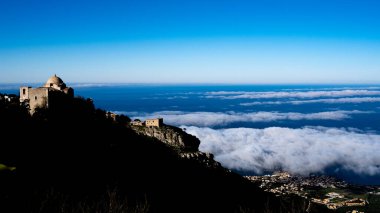 View from Erice with Church of San Giovanni, sea and clouds. Sicily Italy