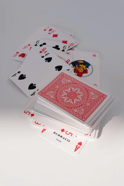 French cards on white table in game burraco.