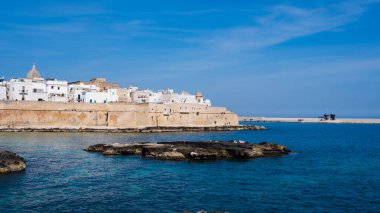 view of the old town and blue sea of Monopoli, Puglia. Italy