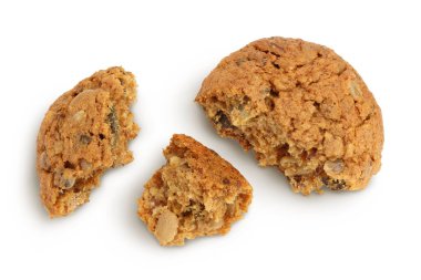 Beyaz arka planda izole edilmiş keten, balkabağı ve ayçiçeği tohumlu yulaf ezmeli kurabiyeler kırpma yolu ve tam derinlik. Üst Manzara. Düz yatıyordu