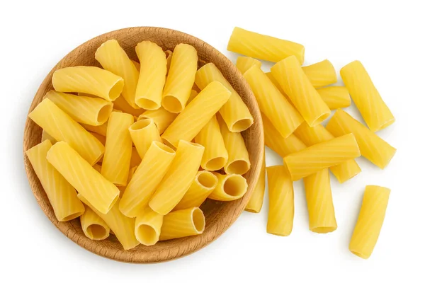 Raw italian Rigatoni pasta in wooden bowl isolated on white background with clipping path and full depth of field. Top view. Flat lay — Stock Photo, Image