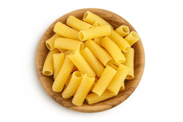 Raw italian Rigatoni pasta in wooden bowl isolated on white background with clipping path and full depth of field. Top view. Flat lay — Stock Photo, Image