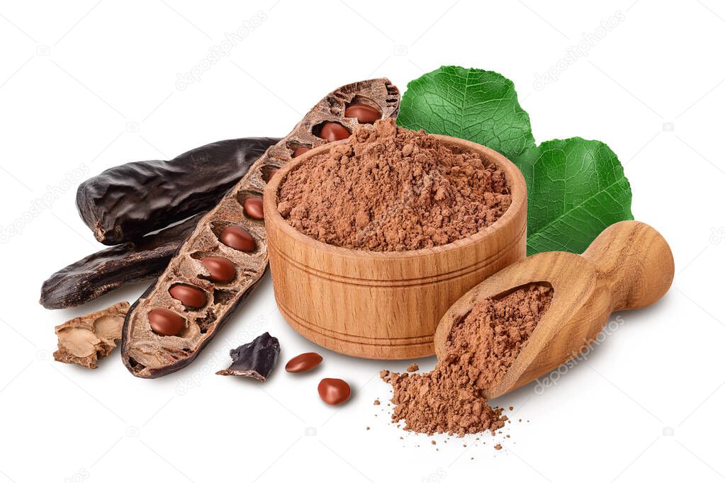 Carob pod and powder in wooden bowl isolated on white background with full depth of field