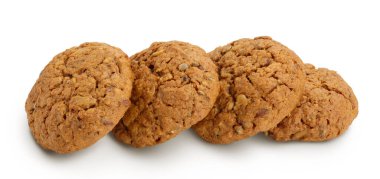 keten, balkabağı ve ayçiçeği tohumlu yulaflı kurabiyeler beyaz arka planda tam derinlikte izole edilmiş..