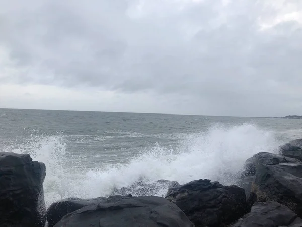 stormy waves crashing on the rocks