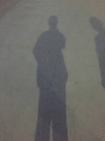 silhouette of a man with a bag