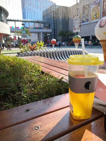 glass of beer and ice cubes on the street