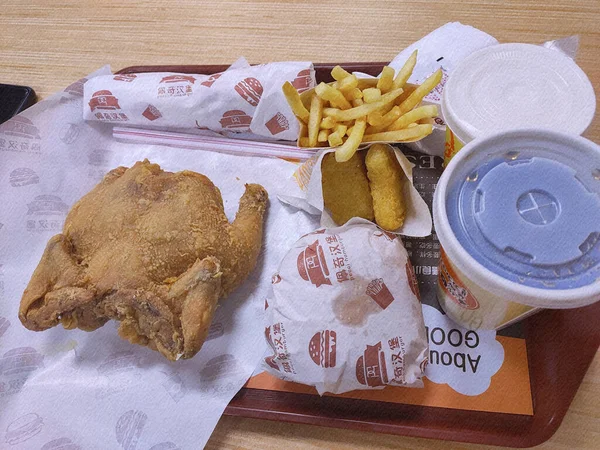 french fries and chips on a wooden table