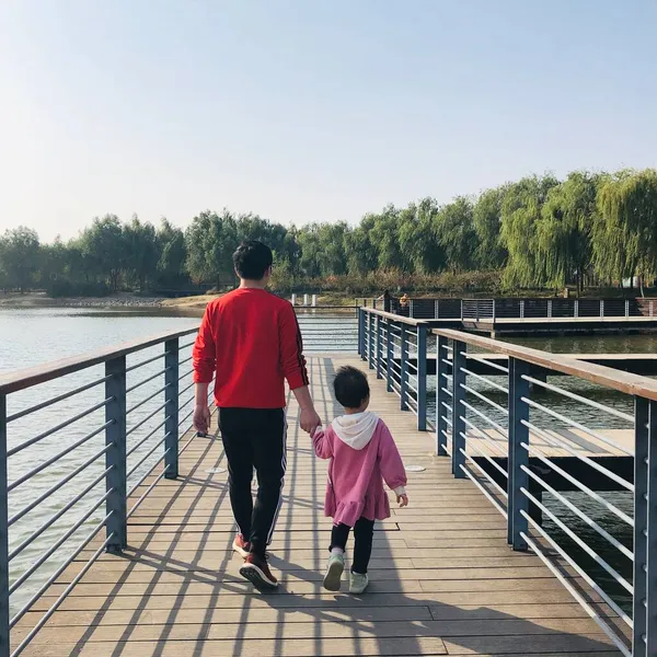 young couple walking on the pier