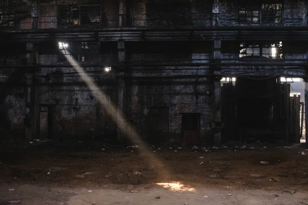 dark abandoned factory with a lot of light