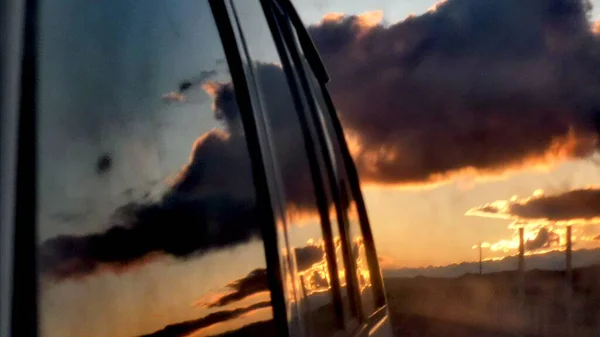 view of the sky and the window of the car