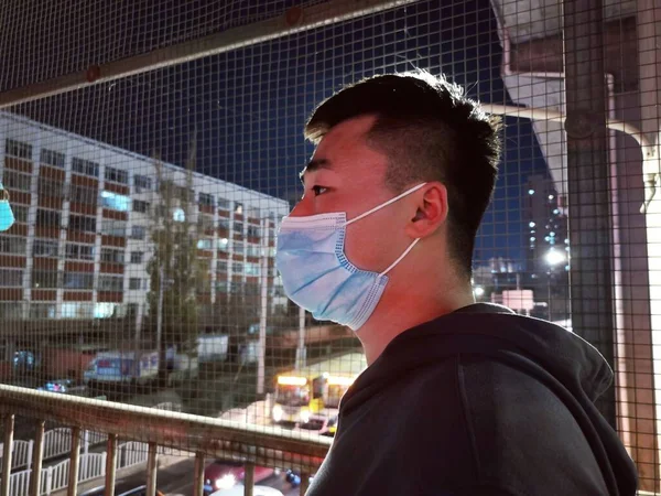 man in mask and protective face masks on the street