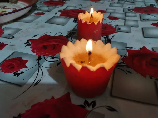 red candles and candle on a table