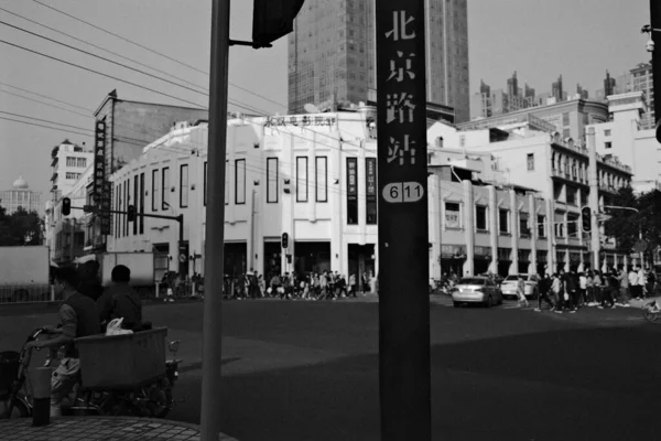 black and white photo of a street in the city