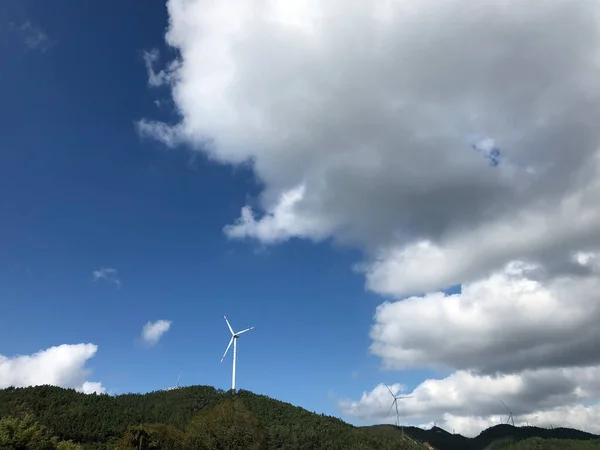 stock image wind turbine in the mountains