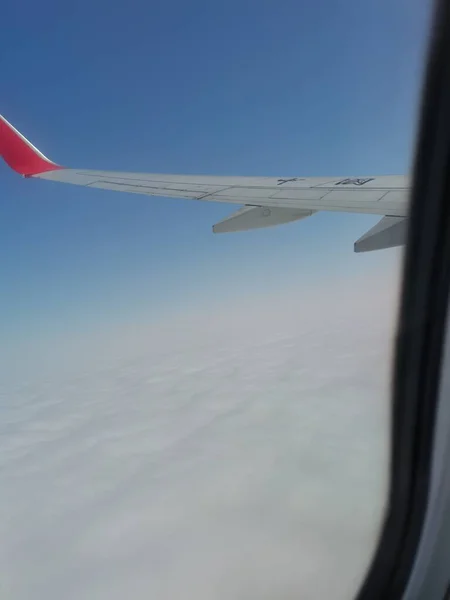 airplane wing and sky in the plane