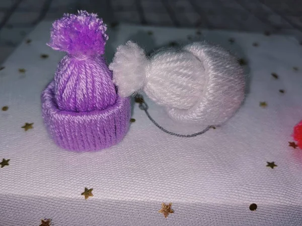 handmade knitted toy with a ball on a white background