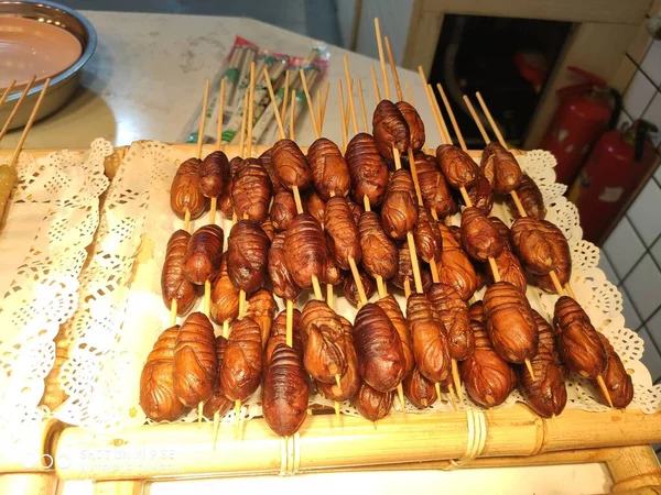 grilled sausages on a market stall