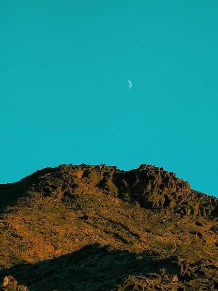 beautiful landscape with a moon and a mountain