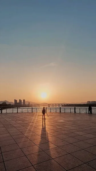 silhouette of a man on the bridge