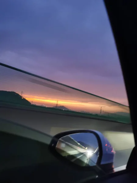 car driving through the window of the sun