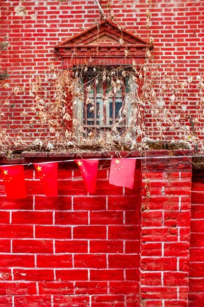 red brick wall with a window