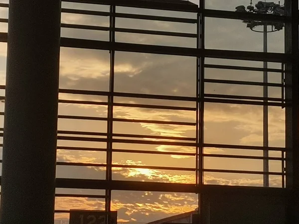 window with sunset sky and clouds