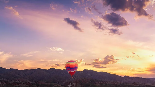colorful hot air balloon in the mountains