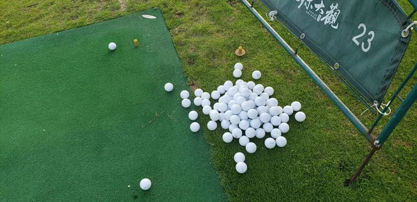 top view of golf ball on green grass