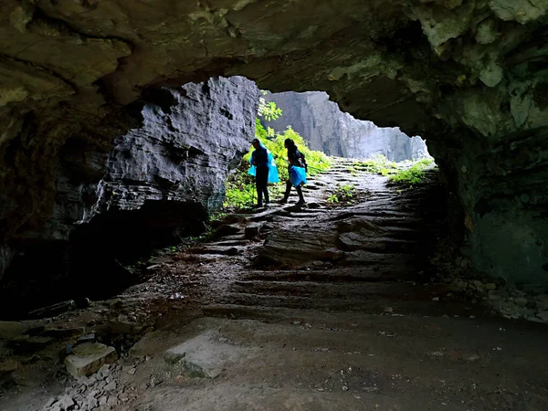 man walking in the cave