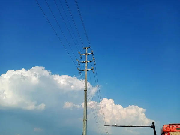 high voltage power lines and blue sky