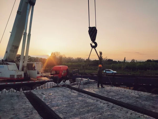 construction worker working on a bridge at the port of the city