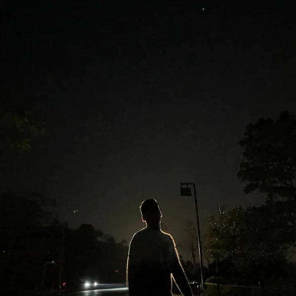 silhouette of a man on the background of the night sky