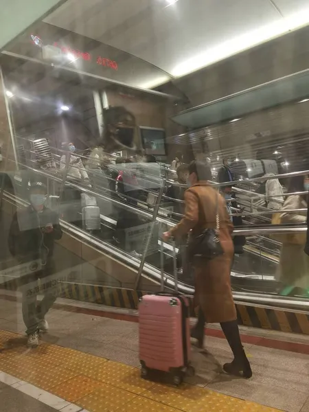 woman with a bag of coffee in the airport