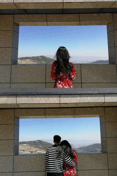 couple in love looking at the window