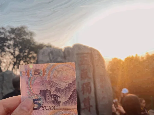 the russian money is a person is holding a paper and a flag of the state of the united states