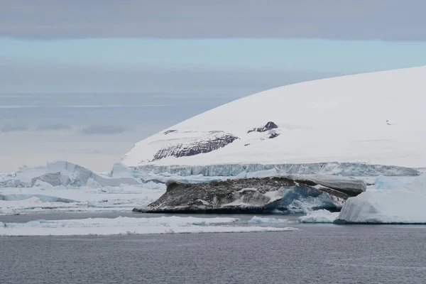 antarctic landscape with iceberg and snow