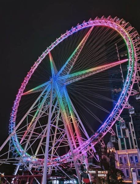 ferris wheel in amusement park, london, uk
