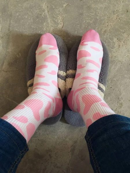 woman legs in socks on a floor