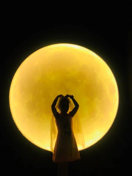 woman with moon and stars in the night sky
