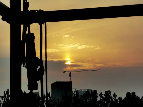 silhouette of a man and a woman on the construction site