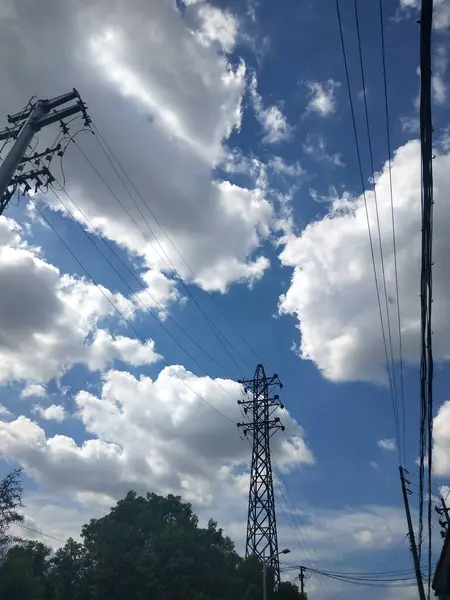 stock image high voltage power lines in the sky