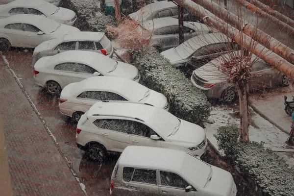 winter snow-covered car with a lot of cars