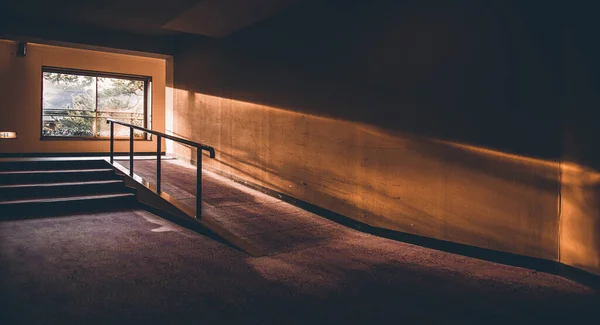 empty room with wooden floor and stairs