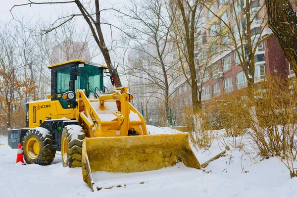 snow-covered construction of a heavy duty excavator
