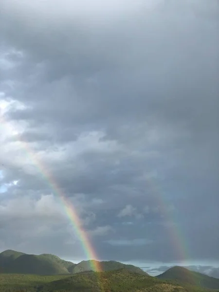 beautiful landscape with clouds and rainbow