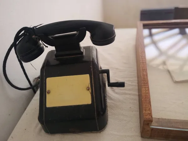 old vintage telephone on a wooden table