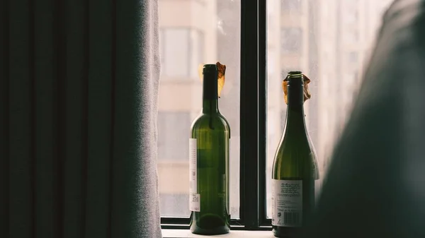 empty glass bottles with wine bottle on wooden background