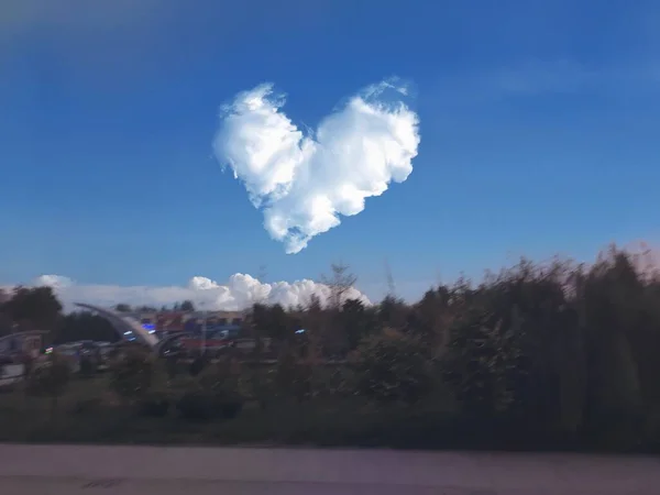 beautiful landscape with a heart and a cloud